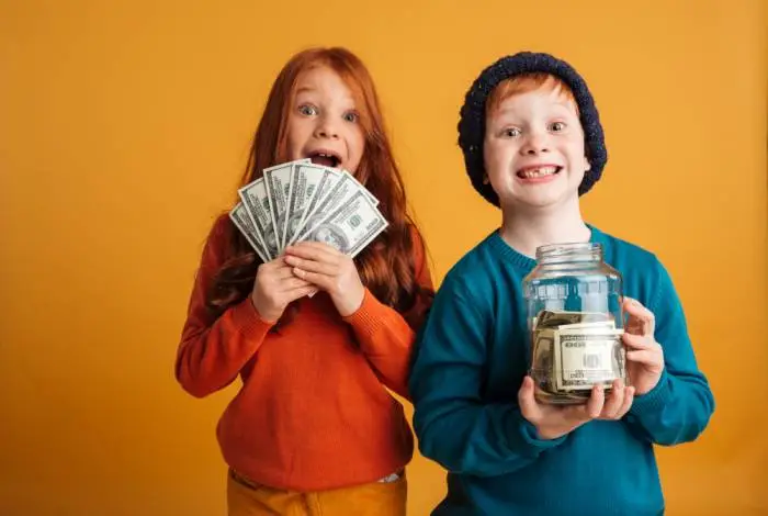 excited-little-redhead-children-holding-money-_1_